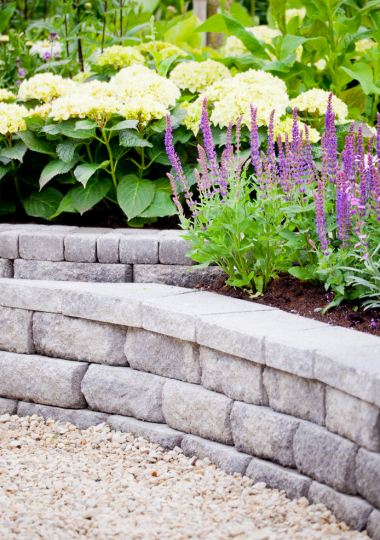 Mix of hardscapes and fresh flowers in white and purple